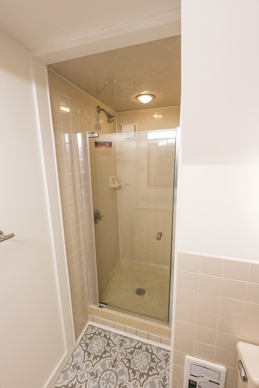 369 Savin Hill Avenue, Unit 3 Boston, MA 02125 - Photo 8 of 16 a bathroom with a shower and a toilet
