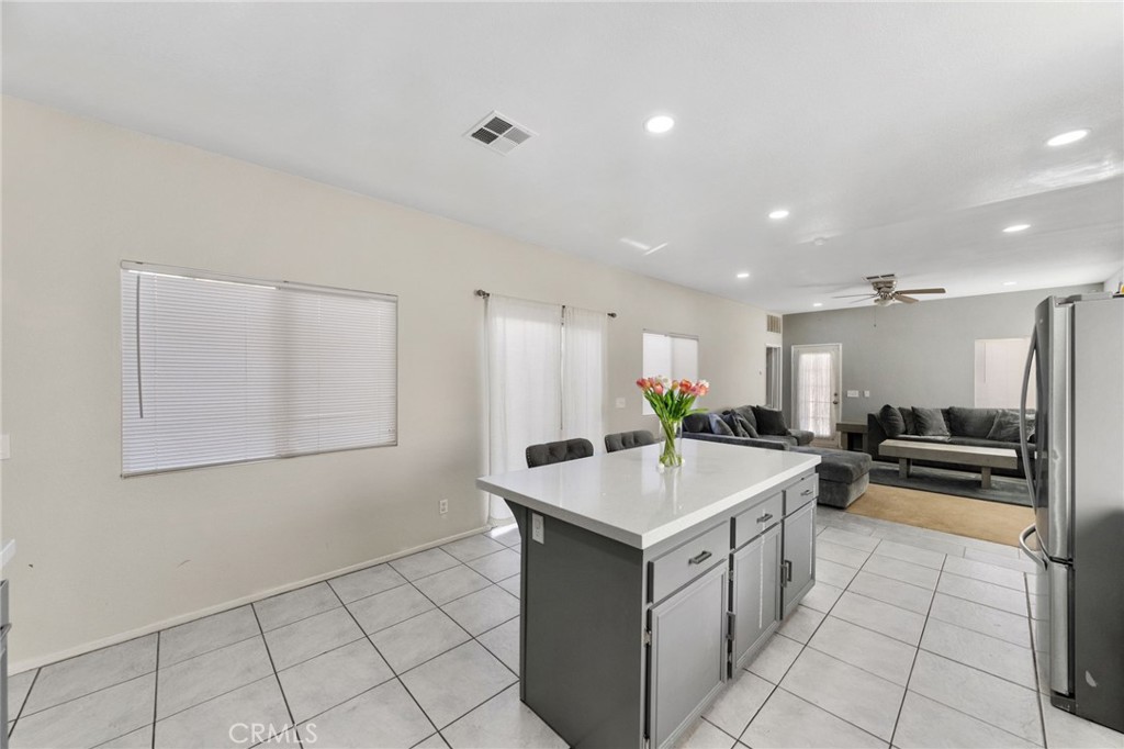 1494 Rabbit Peak Way Hemet, CA 92545 - Photo 14 of 45 a kitchen with a sink a counter top space and appliances