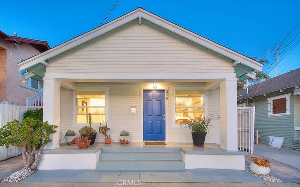 a backyard of a house with outdoor seating
