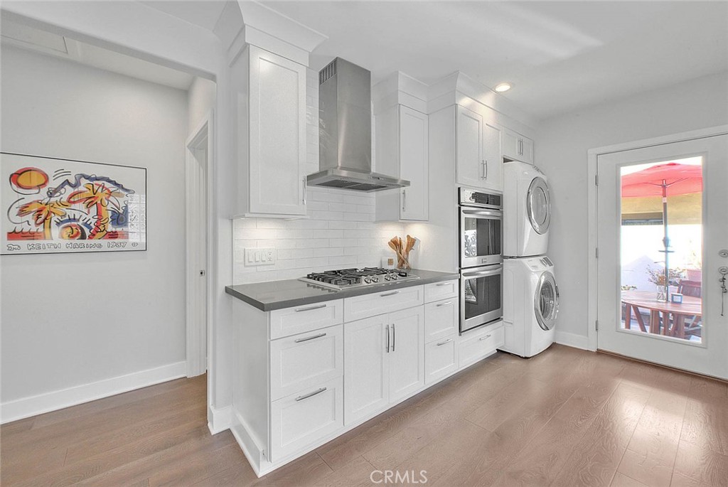 256 Falcon Avenue Long Beach, CA 90802 - Photo 12 of 42 a kitchen with stainless steel appliances granite countertop a stove and a refrigerator