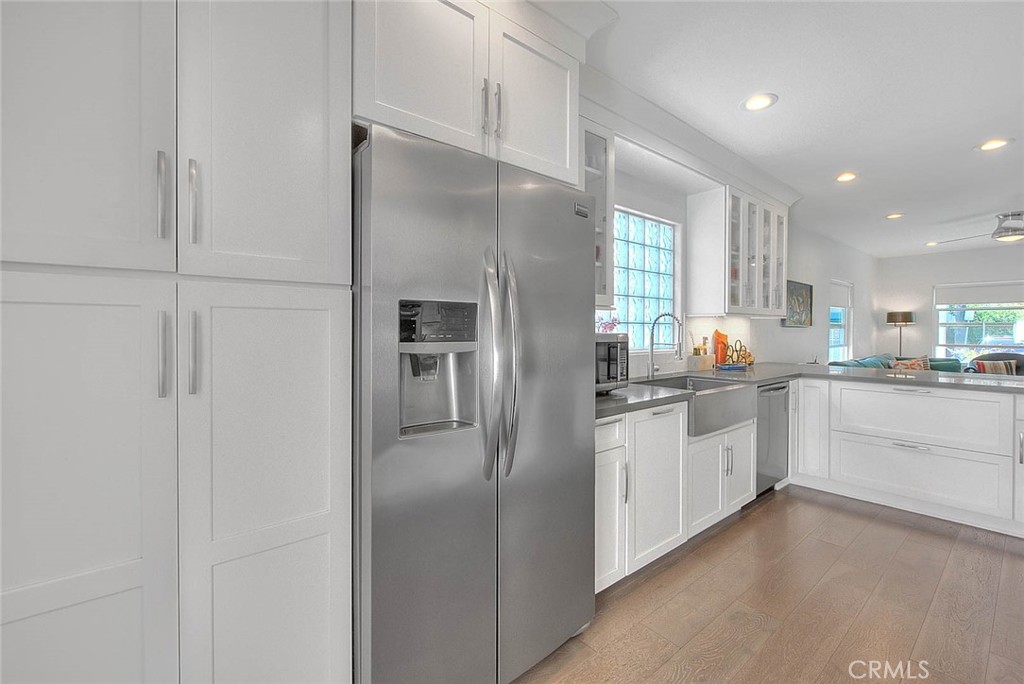 256 Falcon Avenue Long Beach, CA 90802 - Photo 18 of 42 a kitchen with stainless steel appliances a refrigerator sink and cabinets