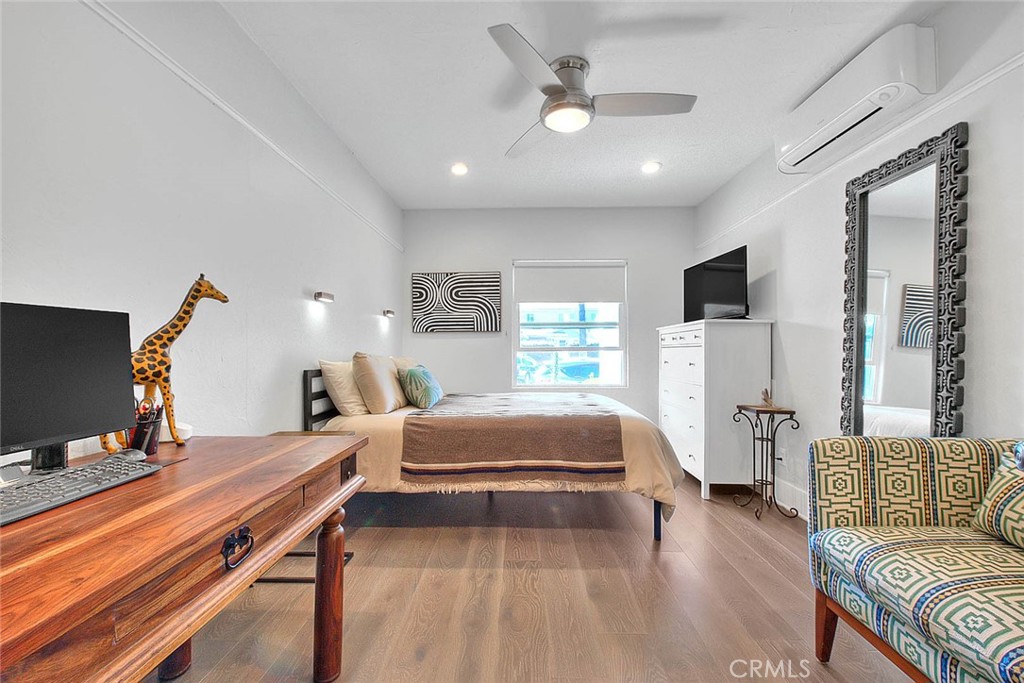 256 Falcon Avenue Long Beach, CA 90802 - Photo 23 of 42 a bedroom with furniture and a wooden floor