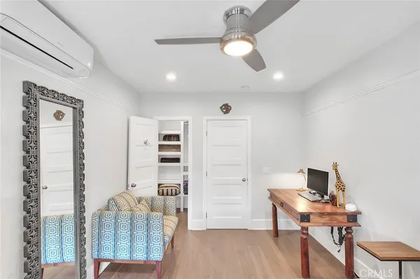 a workspace with furniture and wooden floor