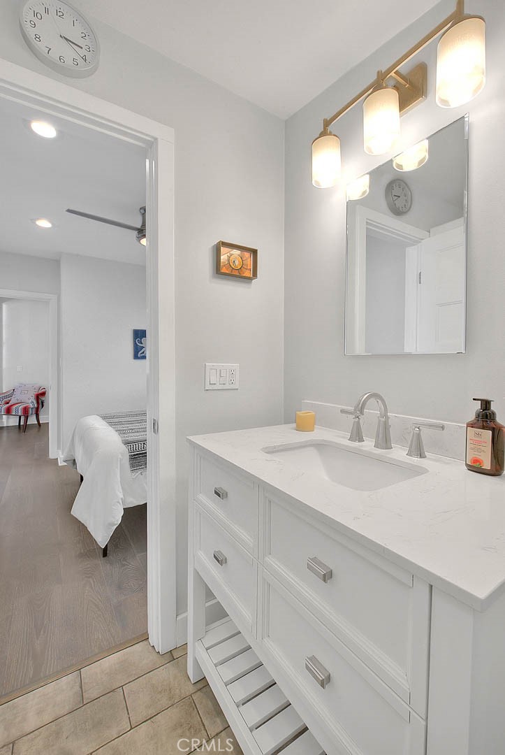 256 Falcon Avenue Long Beach, CA 90802 - Photo 31 of 42 a bathroom with a sink vanity and mirror