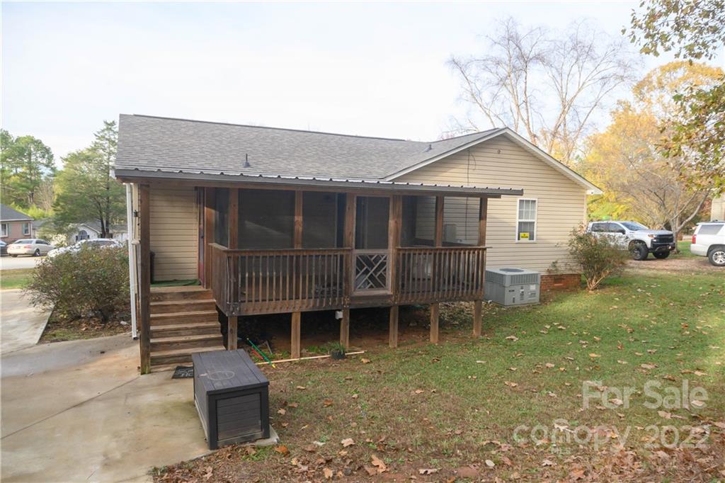 696 Forest Road Rock Hill, SC 29730 - Photo 11 of 15 a view of a house with a wooden deck and a yard