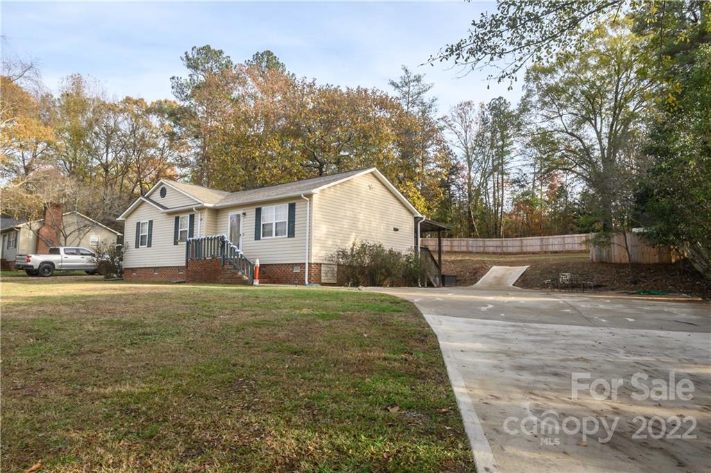 696 Forest Road Rock Hill, SC 29730 - Photo 14 of 15 a front view of a house with a yard and trees