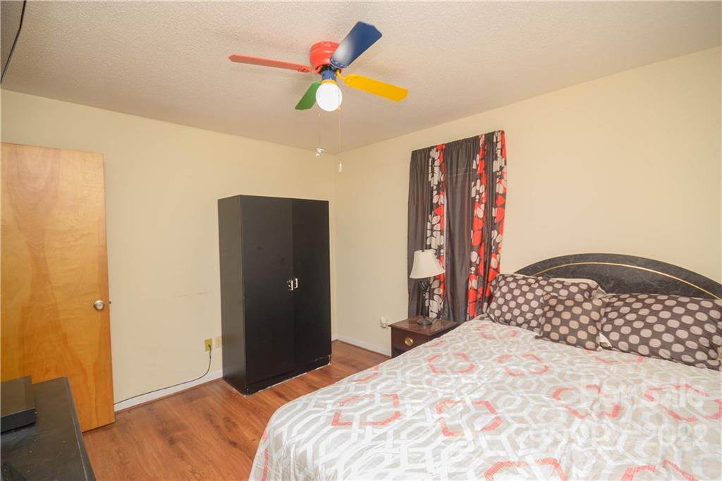 696 Forest Road Rock Hill, SC 29730 - Photo 9 of 15 a bedroom with a bed and a painting on the wall