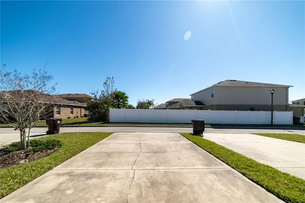 a house view with a backyard space
