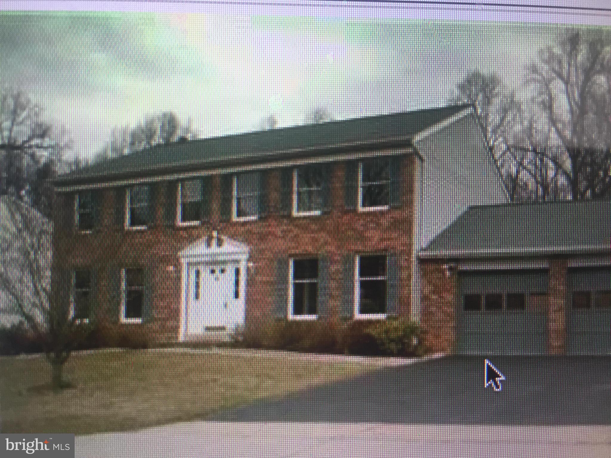 1264 Windmill Lane Silver Spring, MD 20905 - Photo 1 of 1 a front view of a house with a yard