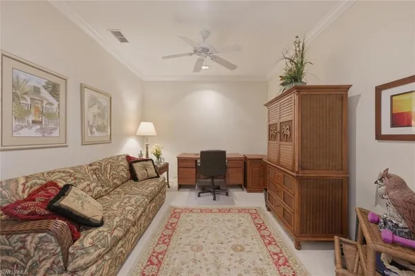 a living room with furniture and a rug