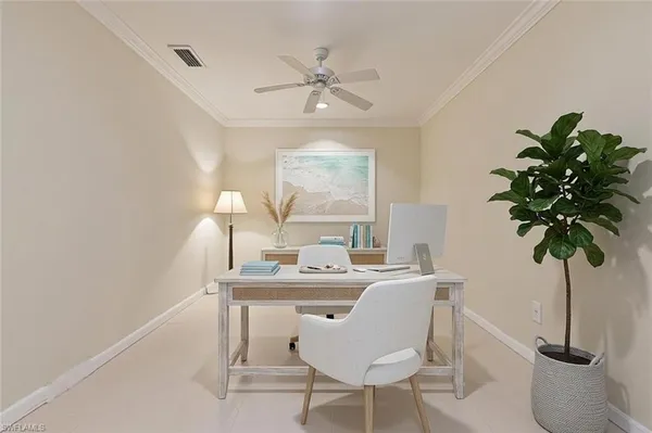 a dining room with furniture and potted plants