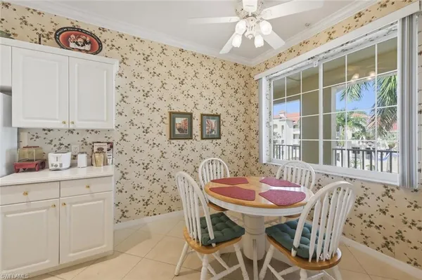 a dining room with furniture and window