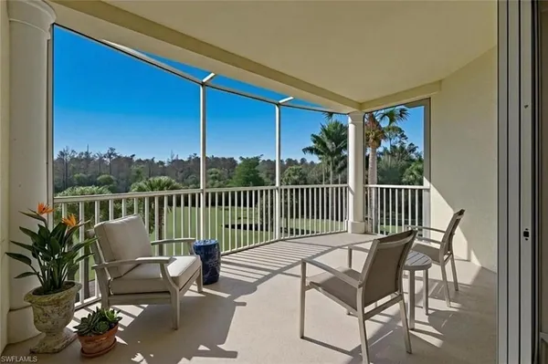 a view of a balcony with wooden floor