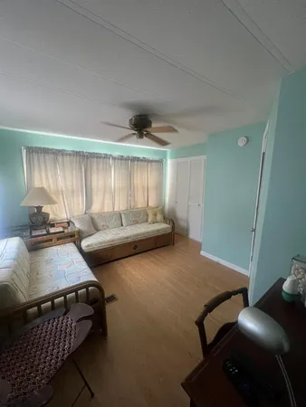 a bedroom with furniture and a window