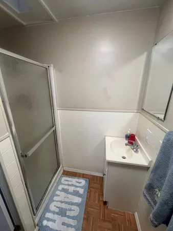 a bathroom with a sink and mirror