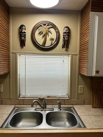 a close view of a sink and a washing machine with a sink