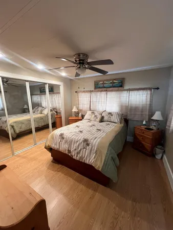 a bedroom with a bed and a chair