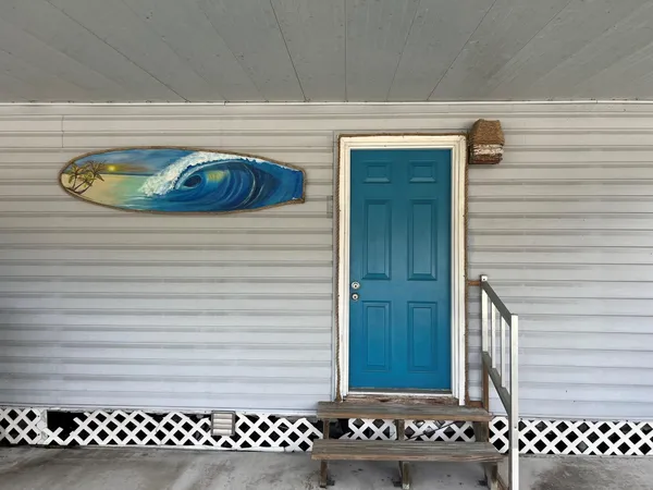 a view of a wooden door of a house