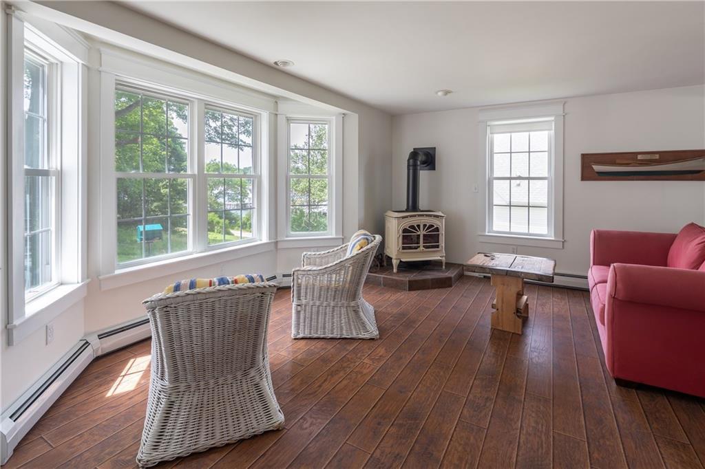 60 Lowells Cove Road Orrs Island, ME 04066 - Photo 7 of 27 The bay window fills the sitting...