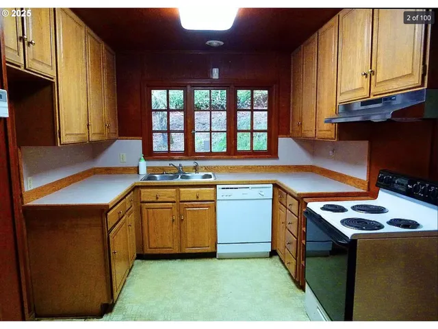 a view of a dining room with furniture and a large window