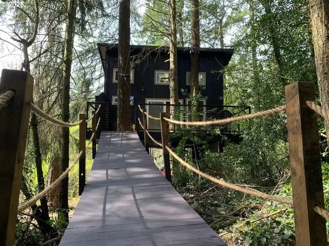 a kitchen with a stove a refrigerator and a dining table