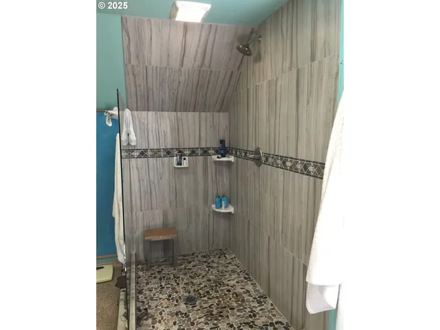 a view of balcony with wooden floor and umbrella