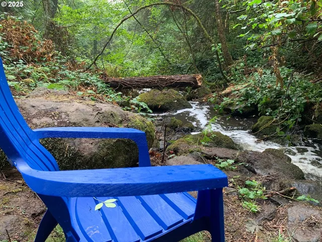 a balcony with wooden floor and outdoor seating