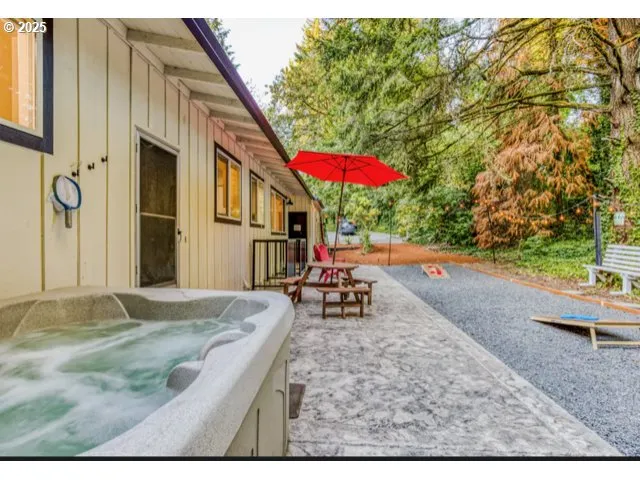 a living room with furniture and a dining table