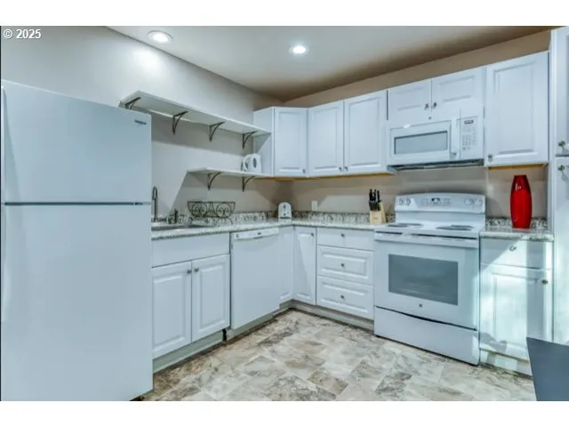 a bedroom with a bed and a desk