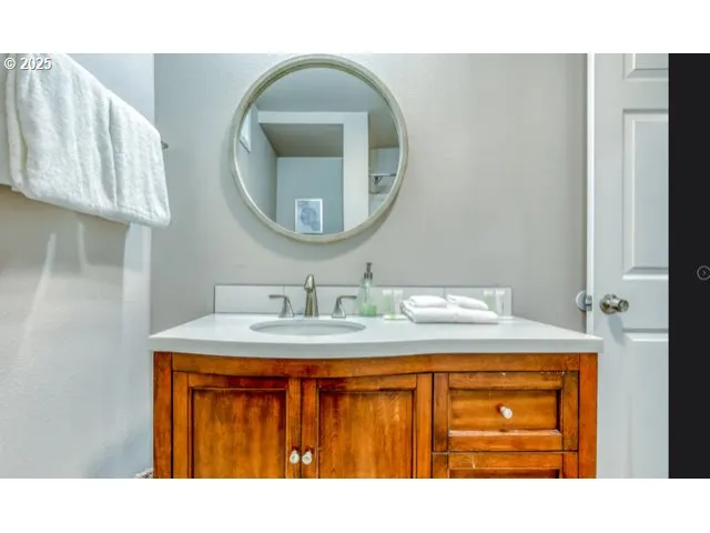 a view of a small house with a tree in the yard