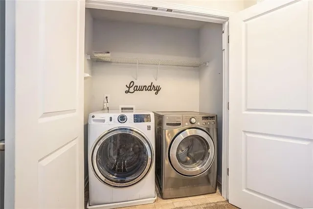a view of washer and dryer in a utility room