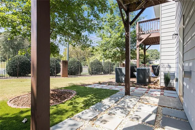 a view of a backyard with sitting area