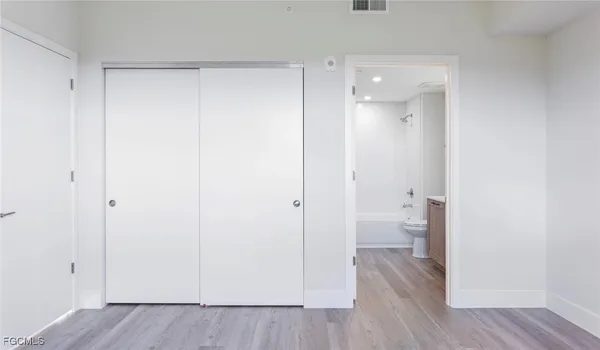 a view of a bathroom from a hallway