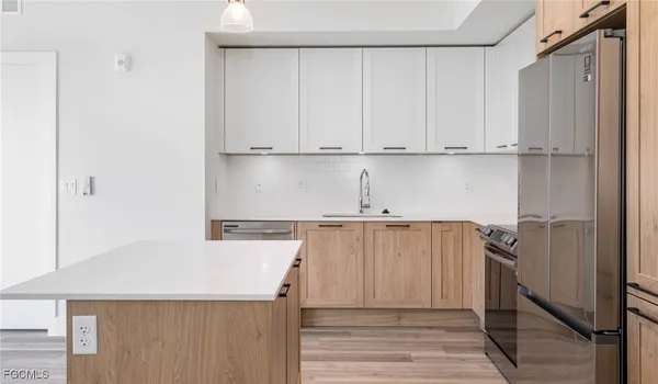 a view of cabinets and wooden floor