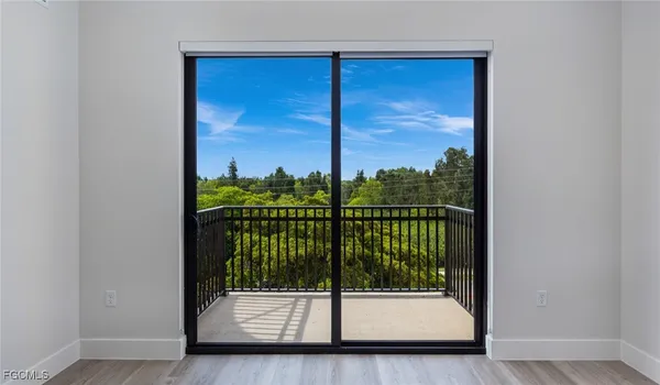 a view of a porch with a floor to ceiling window