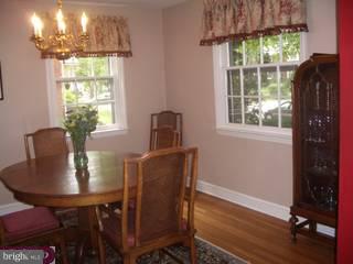 609 Covington Road Havertown, PA 19083 - Photo 3 of 6 a dining room with furniture a chandelier and wooden floor