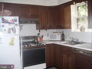 609 Covington Road Havertown, PA 19083 - Photo 4 of 6 a kitchen with stainless steel appliances a stove a sink and a cabinets