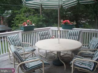 609 Covington Road Havertown, PA 19083 - Photo 6 of 6 a view of a chairs and table in patio of back yard
