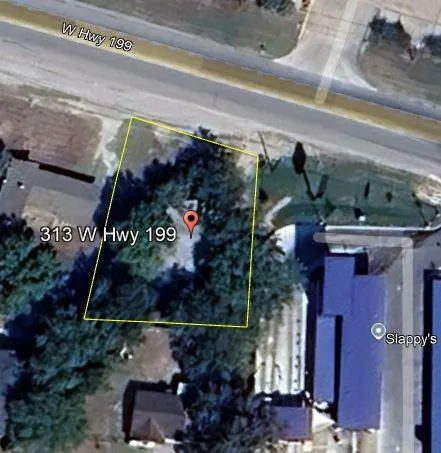 a view of a big yard with swimming pool and green space