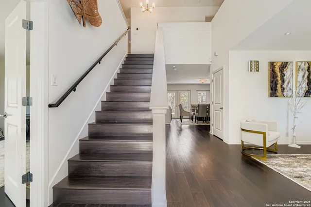 a view of entryway and hall with wooden floor