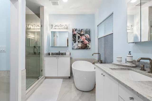 a front view of a house with a yard and trees