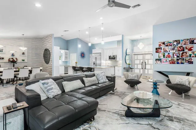 a bedroom with two beds and a flat screen tv