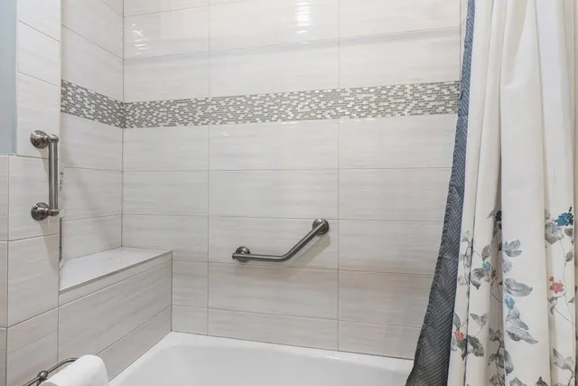 an aerial view of a house with outdoor space and street view