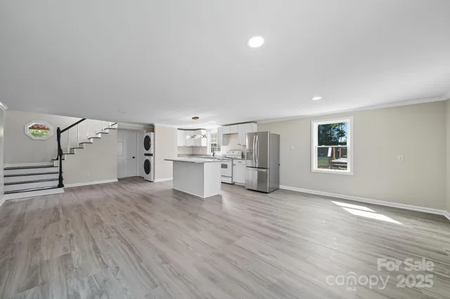 a view of a kitchen with wooden floor