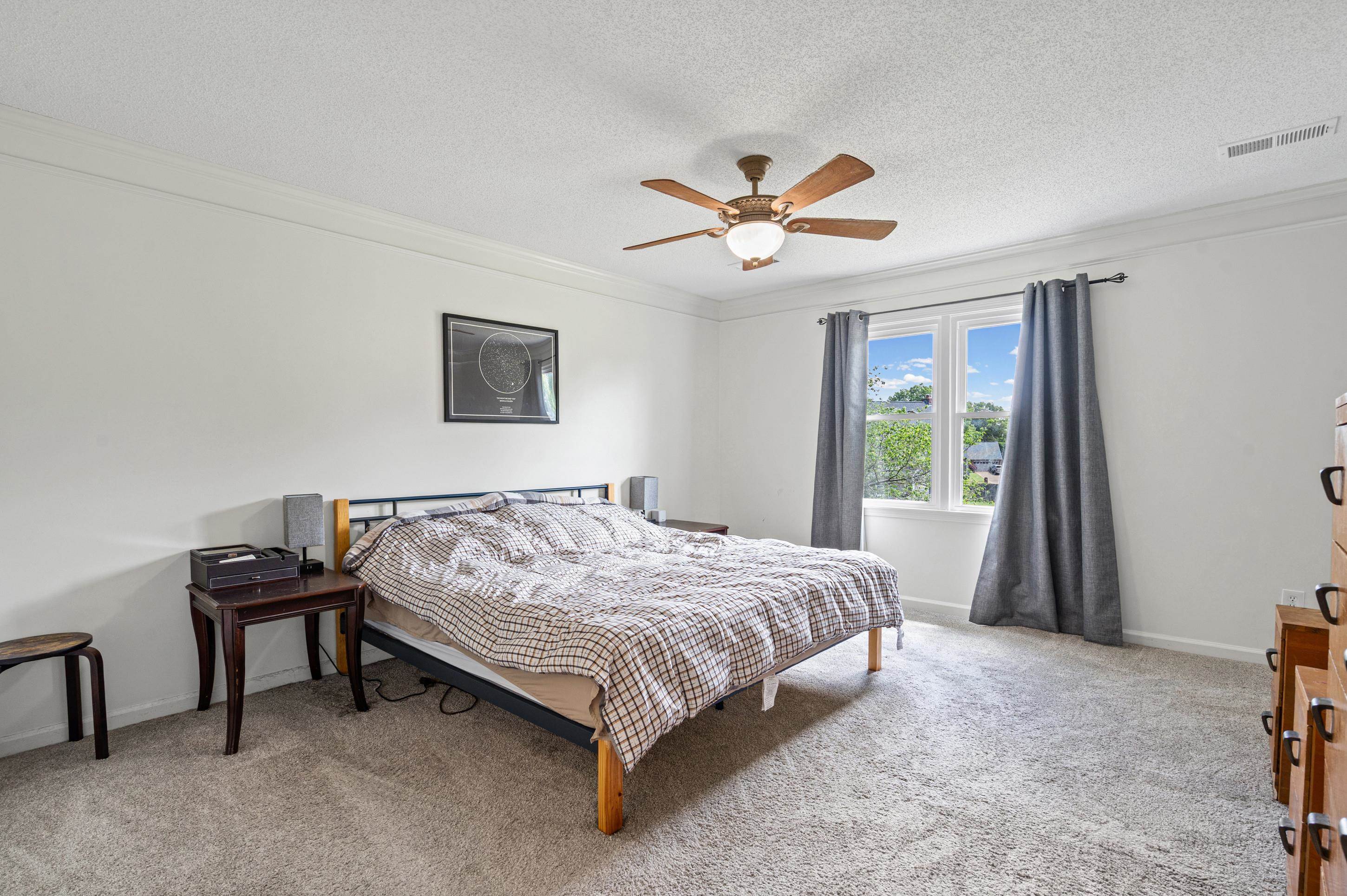 897 Wood Cove Collierville, TN 38017 - Photo 13 of 30 a bedroom with a bed and a chandelier