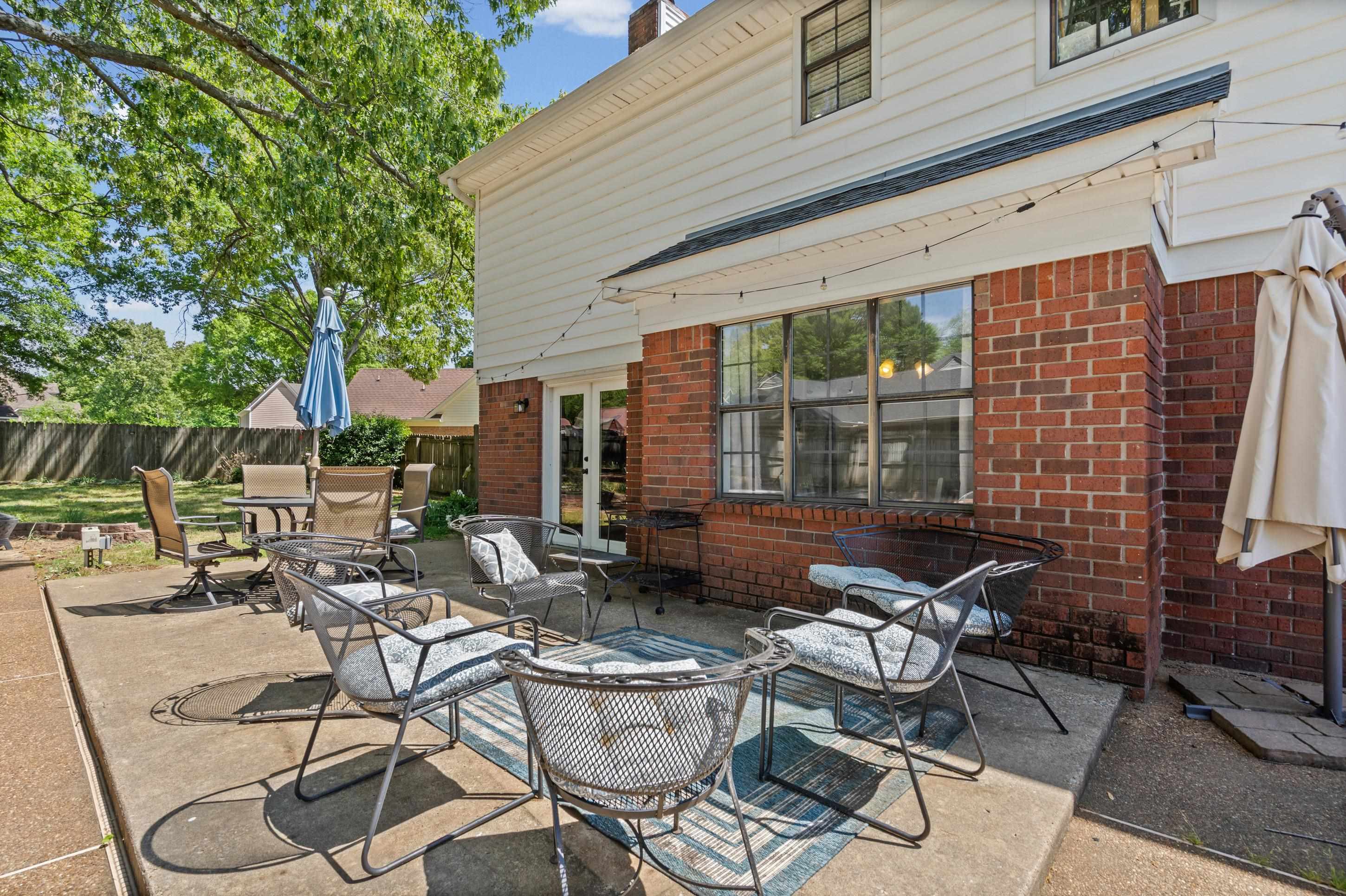 897 Wood Cove Collierville, TN 38017 - Photo 20 of 30 a view of a patio with chairs and tables