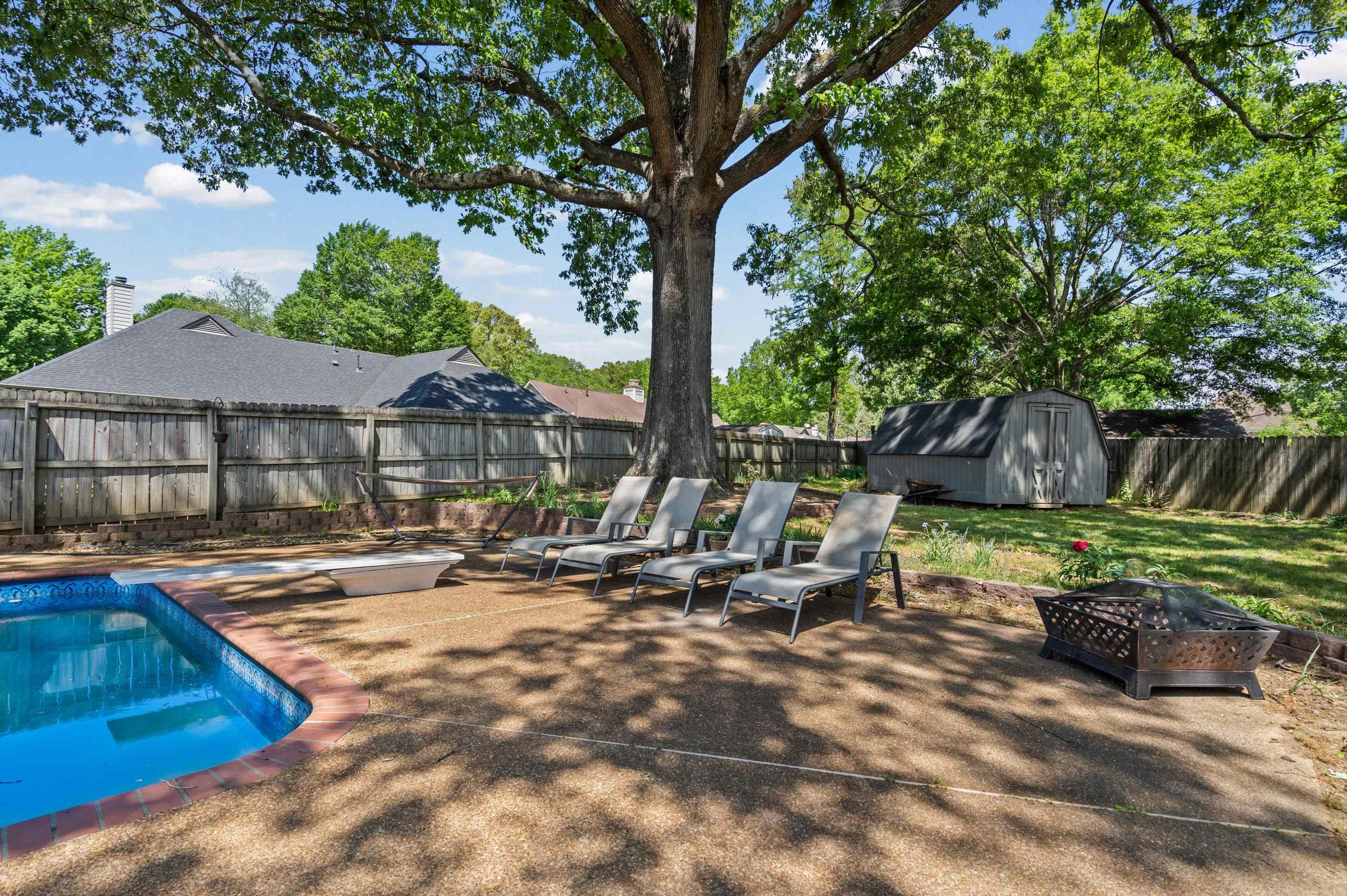 897 Wood Cove Collierville, TN 38017 - Photo 21 of 30 a view of backyard with swimming pool and outdoor seating