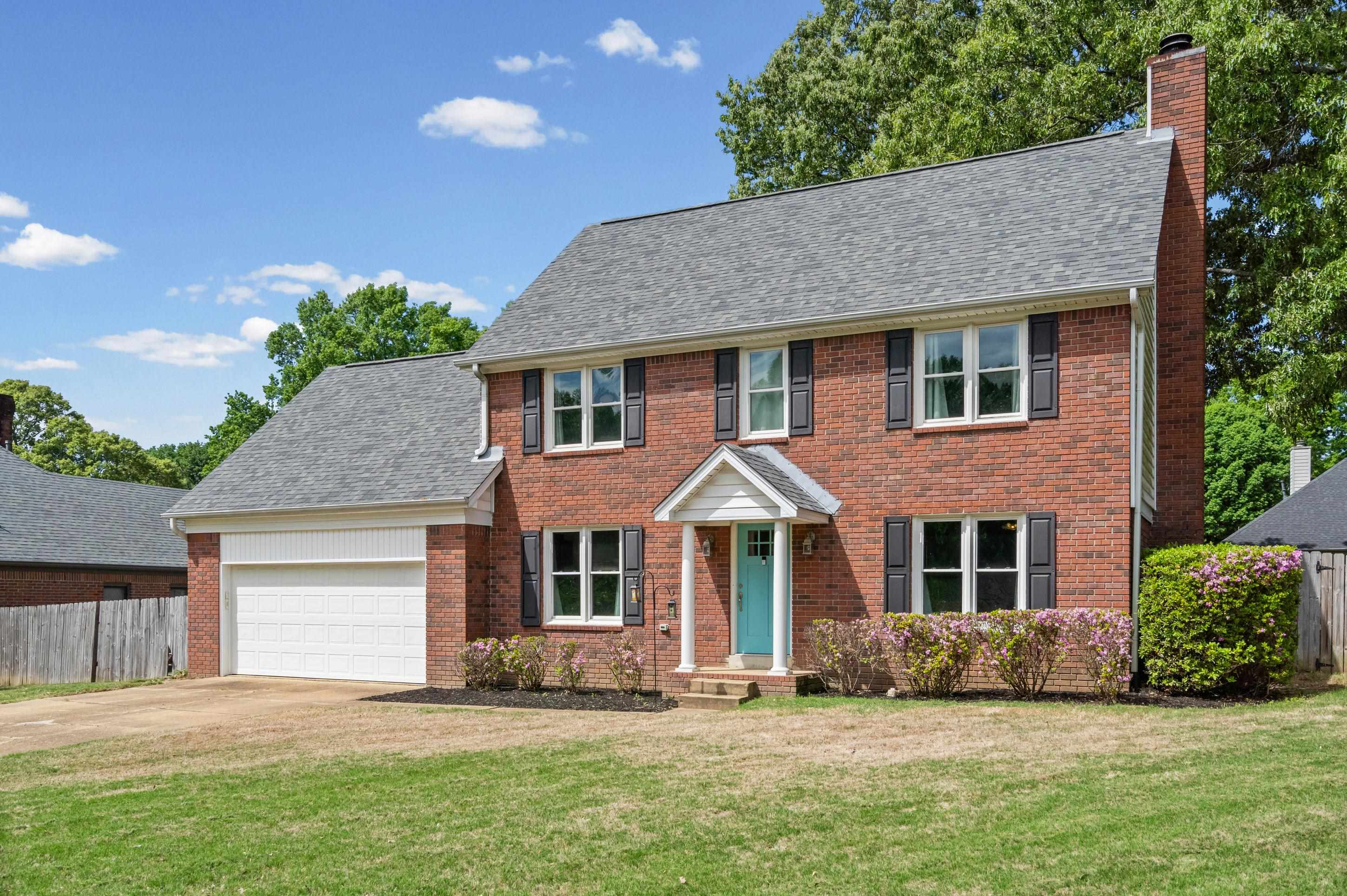 897 Wood Cove Collierville, TN 38017 - Photo 3 of 30 front view of a house with a yard