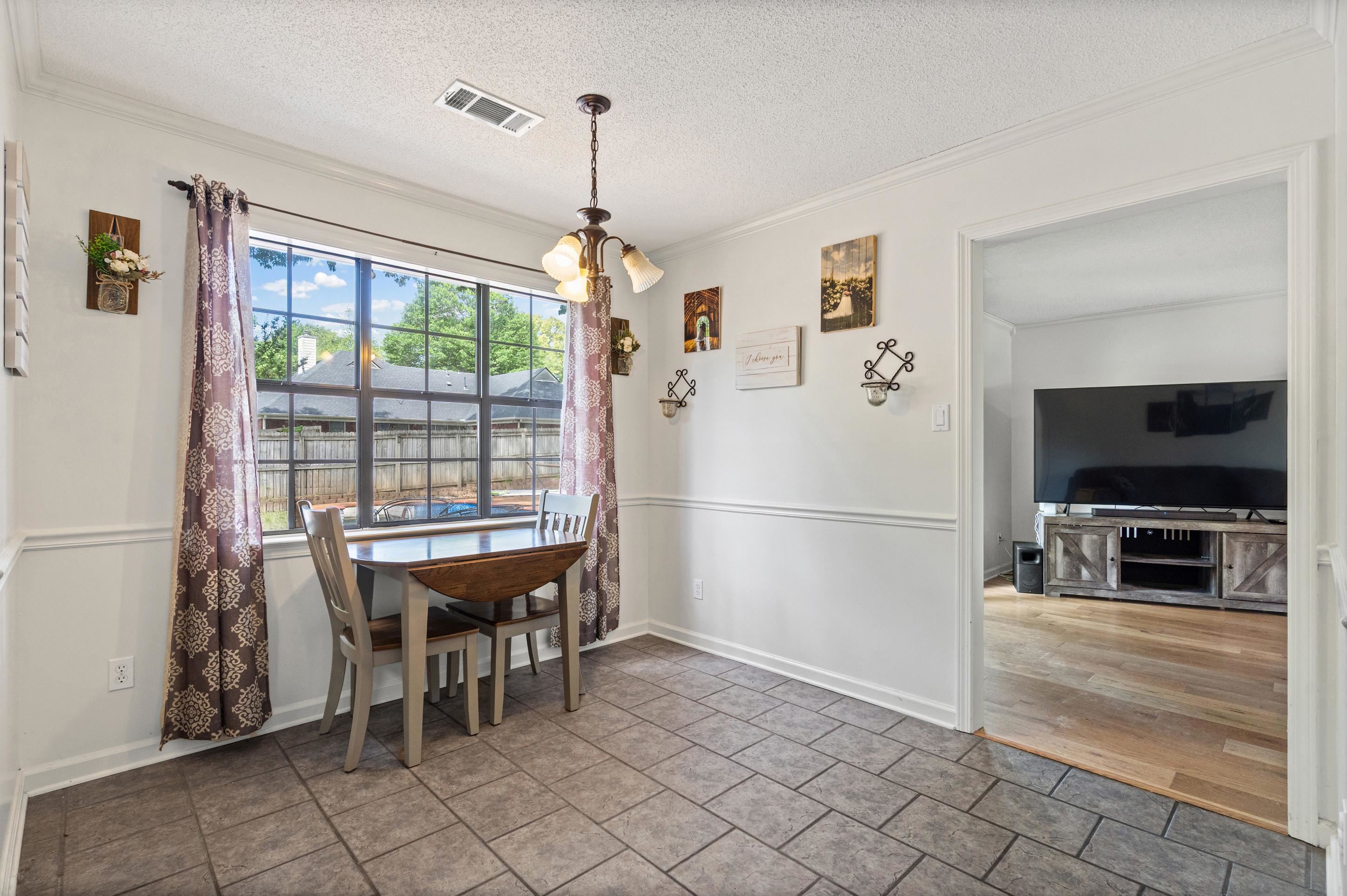 897 Wood Cove Collierville, TN 38017 - Photo 8 of 30 a dining room with furniture and window