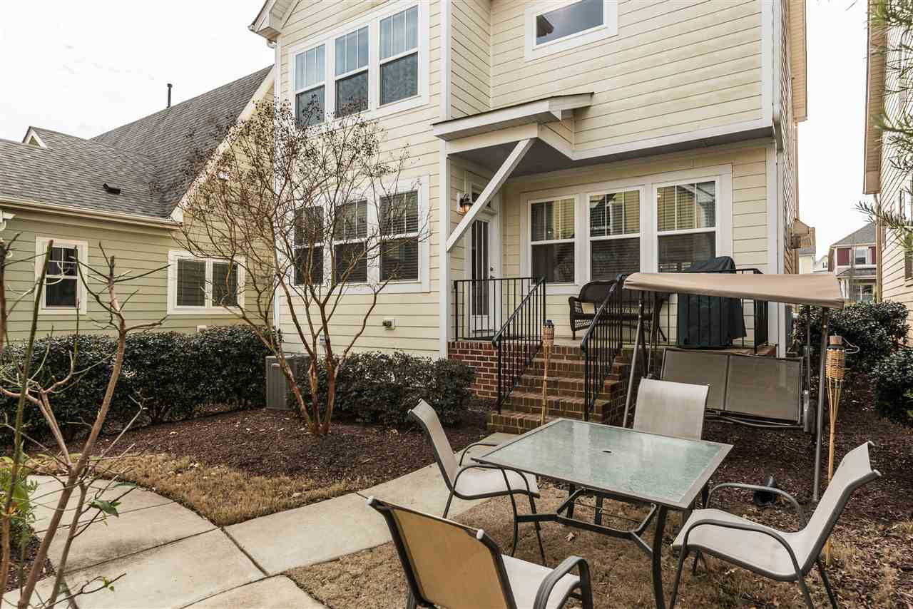 1413 Van Page Boulevard Raleigh, NC 27607 - Photo 20 of 25 ENJOY THE COZY BACK PORCH AND CONVENIENT WALK WAY TO THE GARGE AND SUITE ABOVE GARAGE WITH SEPARATE ENTRYWAYS. BACK EXTERIOR